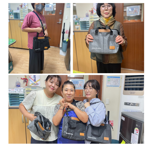 ▲보냉백을 전달 받은 활동지원사 모습 ⓒ문수종합사회복지관